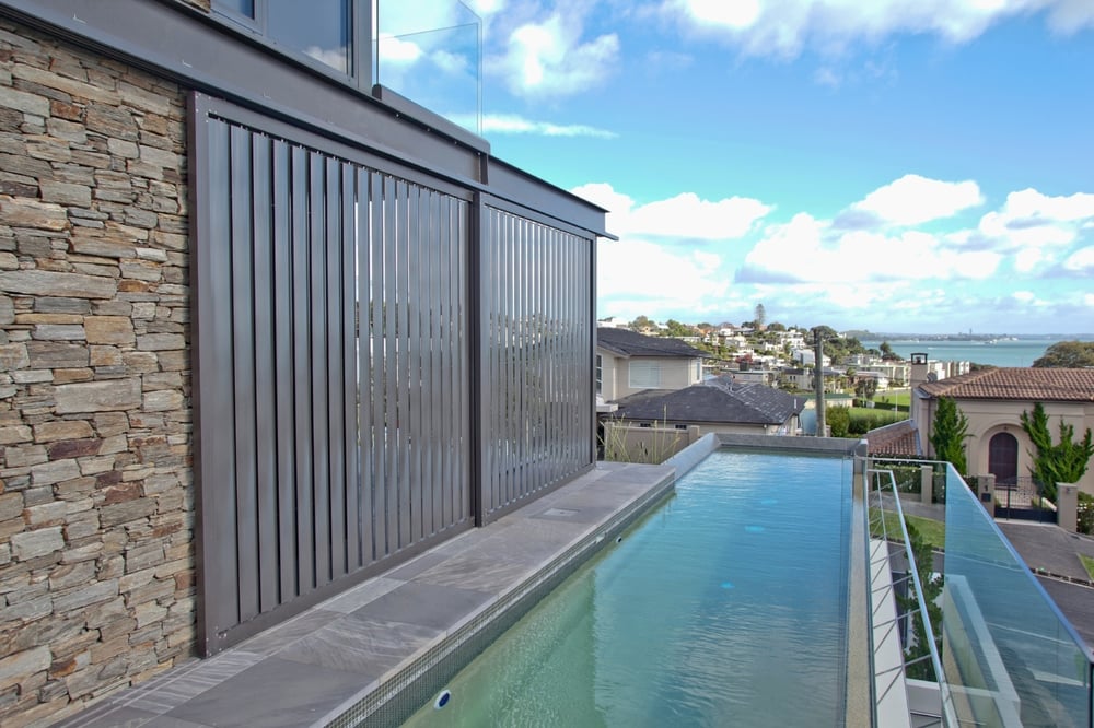 Sliding shutters with operable louvre blades