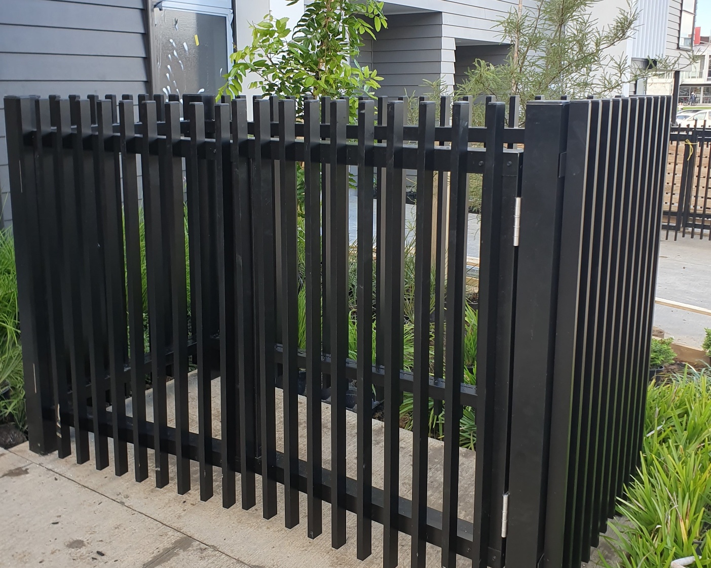 Bin screen with black powder-coated louvre blades