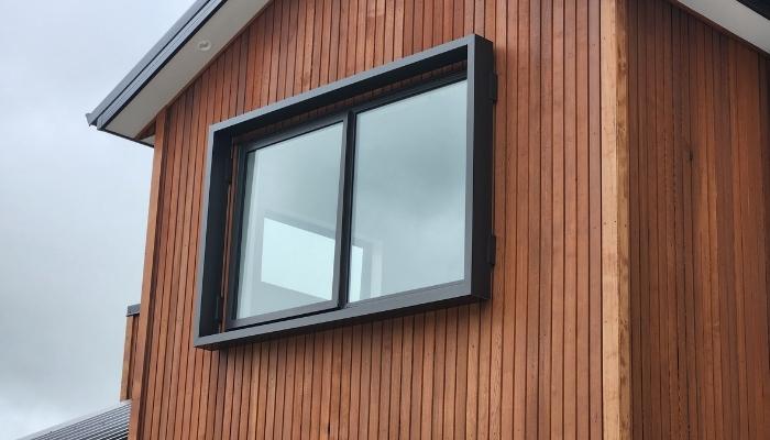 Aurae window shroud on timber facade