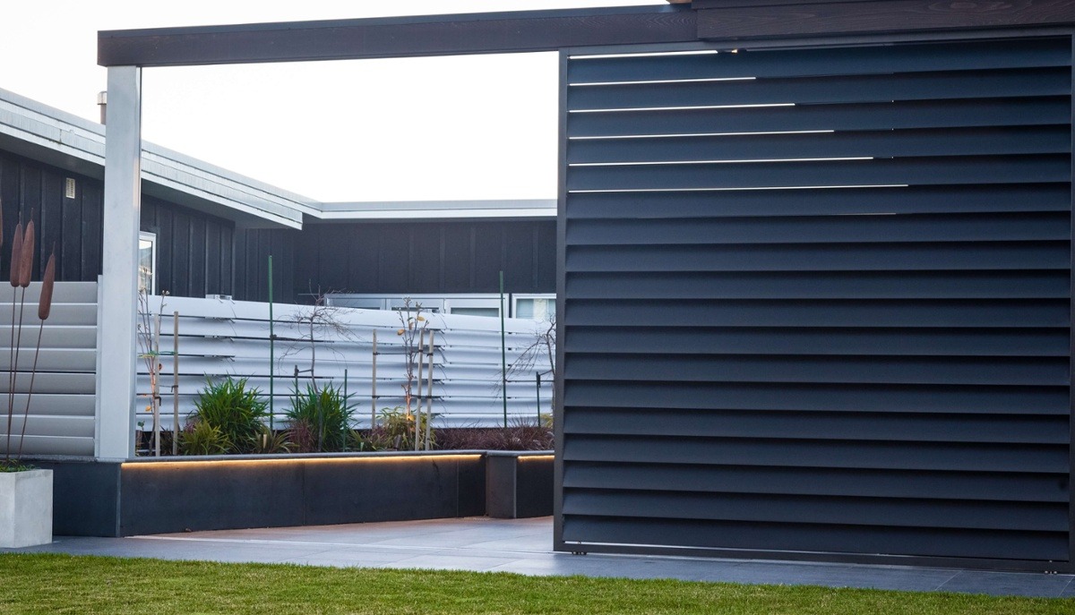 Sliding shutters used for privacy and to close off an outdoor room