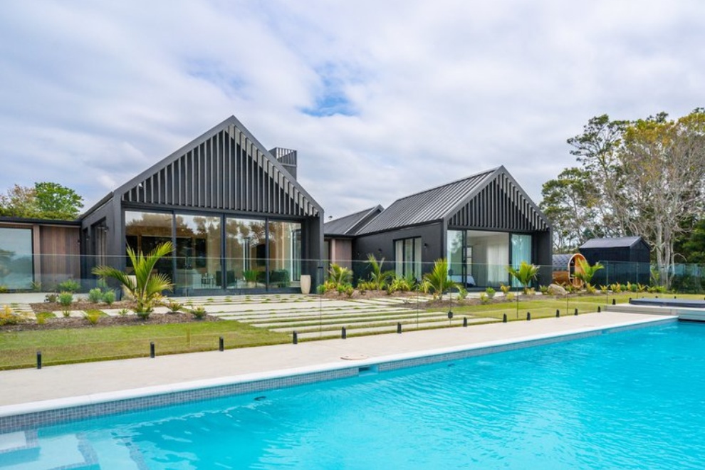Gable end home with louvre panels and chimney cowl Gable end home with louvre panels and chimney cowl