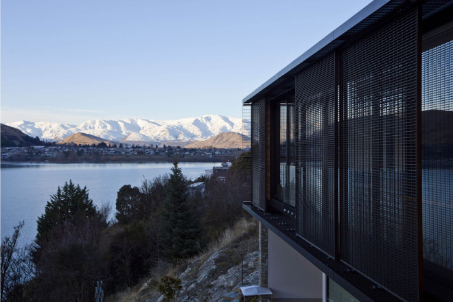 Grated sliding shutters on the exterior of a home